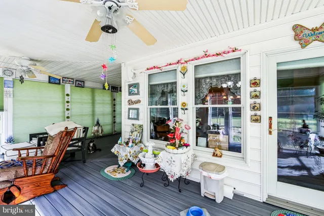 a bedroom with a bed and dresser with mirror