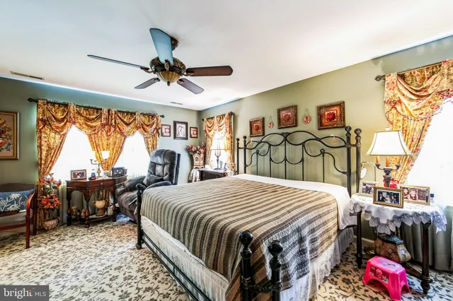 a bed room with a bed and furniture