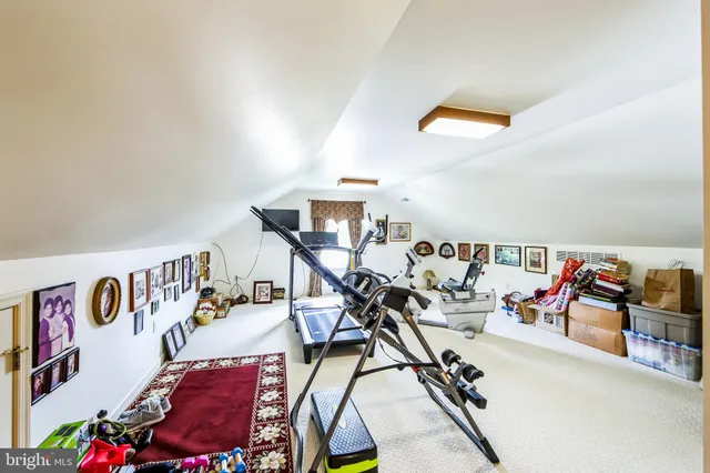 a dining room with a table chairs and a floor to ceiling window
