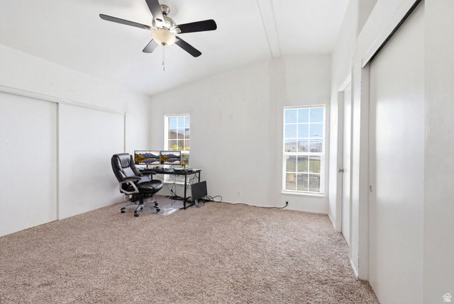 2491 Highway 89, Unit 614 Pleasant View, UT 84404 - Photo 19 of 27 Carpeted interior space featuring an angled ceiling and multiple windows