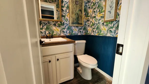 a bathroom with a double vanity sink and a mirror