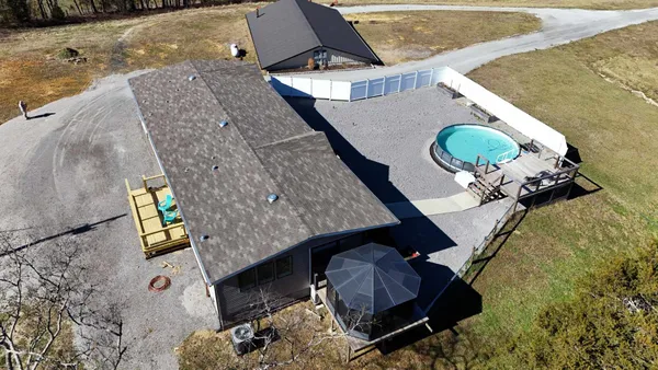 a view of a house with backyard