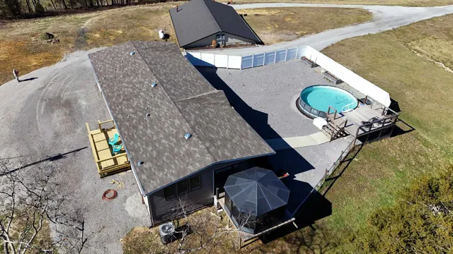 a view of a house with backyard