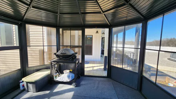 an aerial view of residential houses with outdoor space