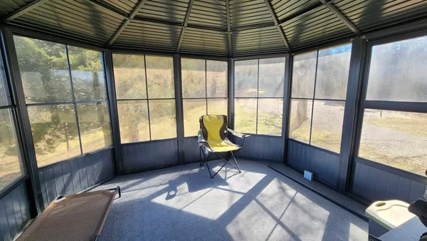 a view of a swimming pool with an outdoor space