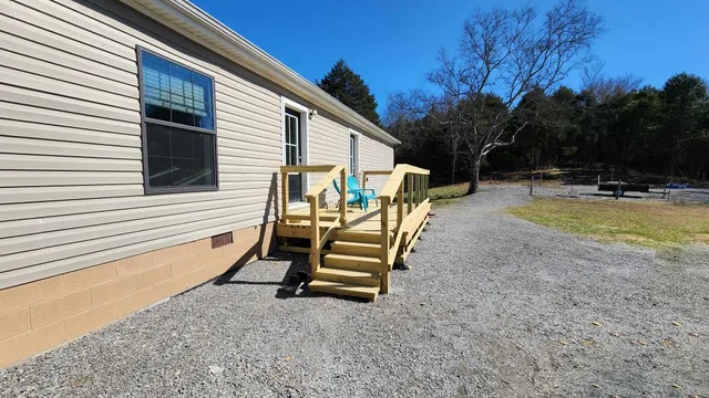 a bedroom with a bed and a ceiling fan