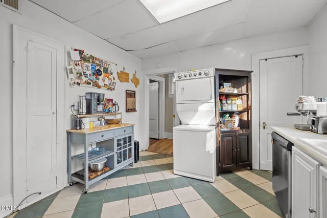 a view of a kitchen with fridge and rack