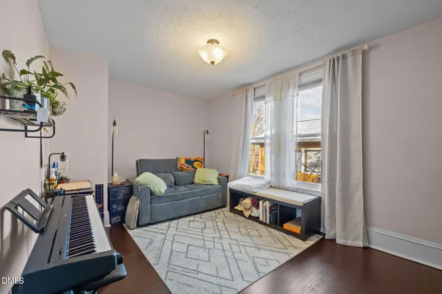 a bedroom with a bed furniture and a window