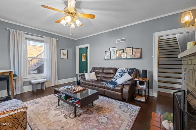 a living room with furniture and a rug