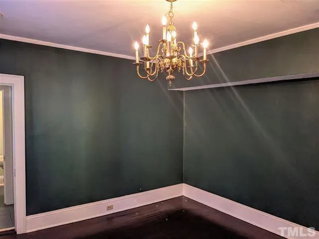 a view of a small space with wooden floor