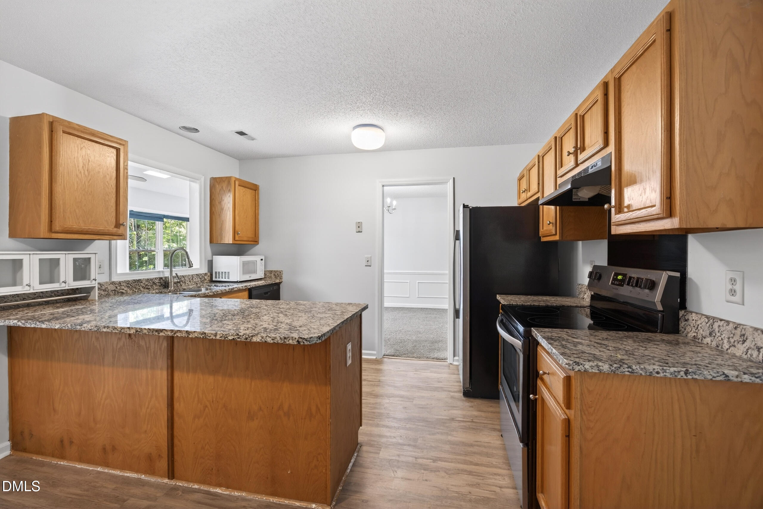 1901 Whites Mill Road High Point, NC 27265 - Photo 11 of 24 a kitchen with stainless steel appliances granite countertop a sink stove and refrigerator