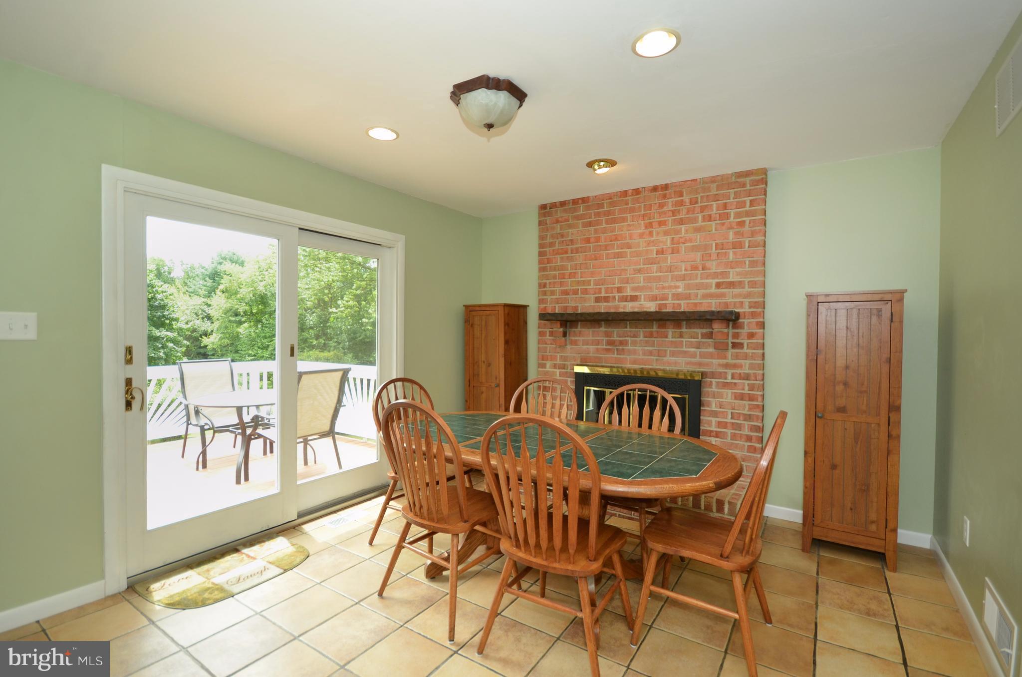 2417 Houcks Mill Road Monkton, MD 21111 - Photo 4 of 26 Kitchen w/ brick fireplace and slider to deck!