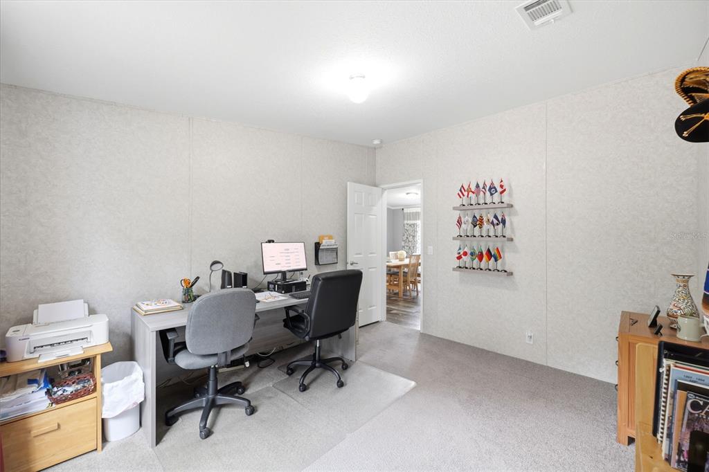 3183 Cedley Road Dade City, FL 33523 - Photo 45 of 48 a view of a workspace with furniture