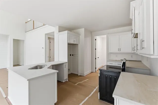 a kitchen with a sink and a refrigerator