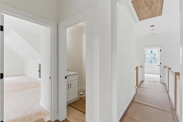 a view of a bathroom from the hallway