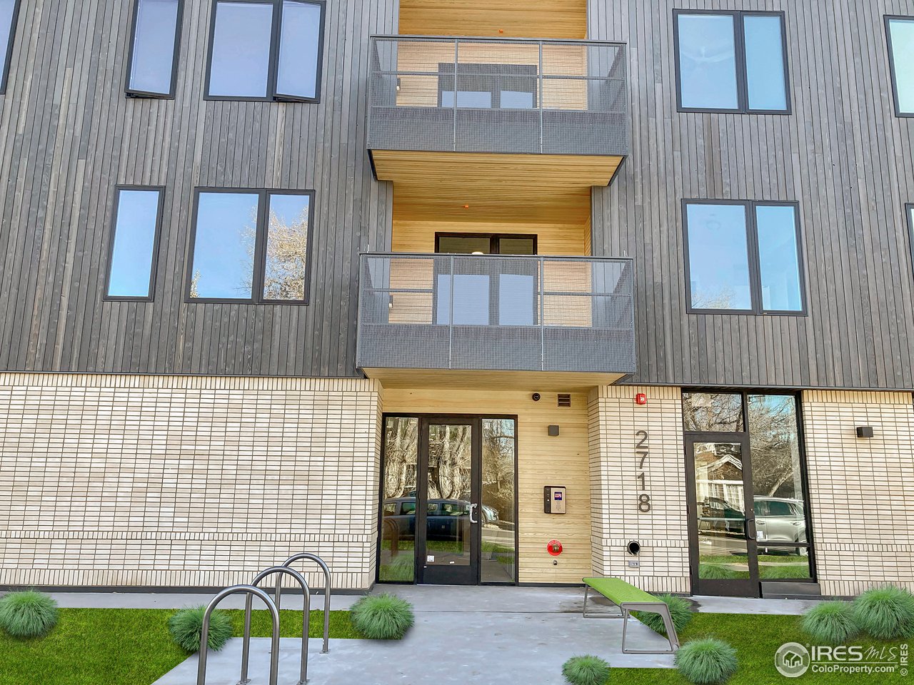 2718 Pine Street, Unit 302 Boulder, CO 80302 - Photo 5 of 24 a front view of a building with a garden