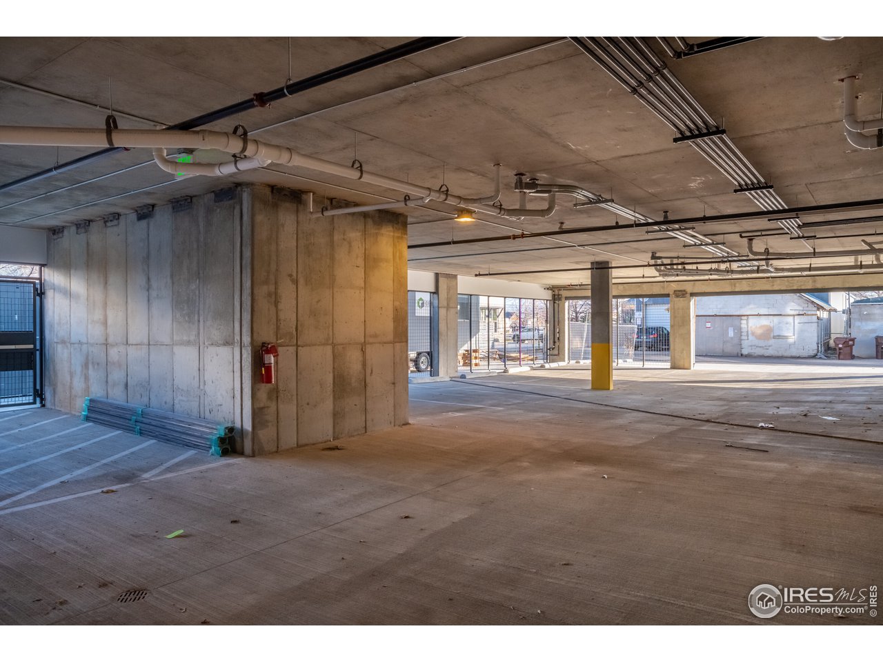 2718 Pine Street, Unit 302 Boulder, CO 80302 - Photo 10 of 24 a view of empty room with wooden floor and fan