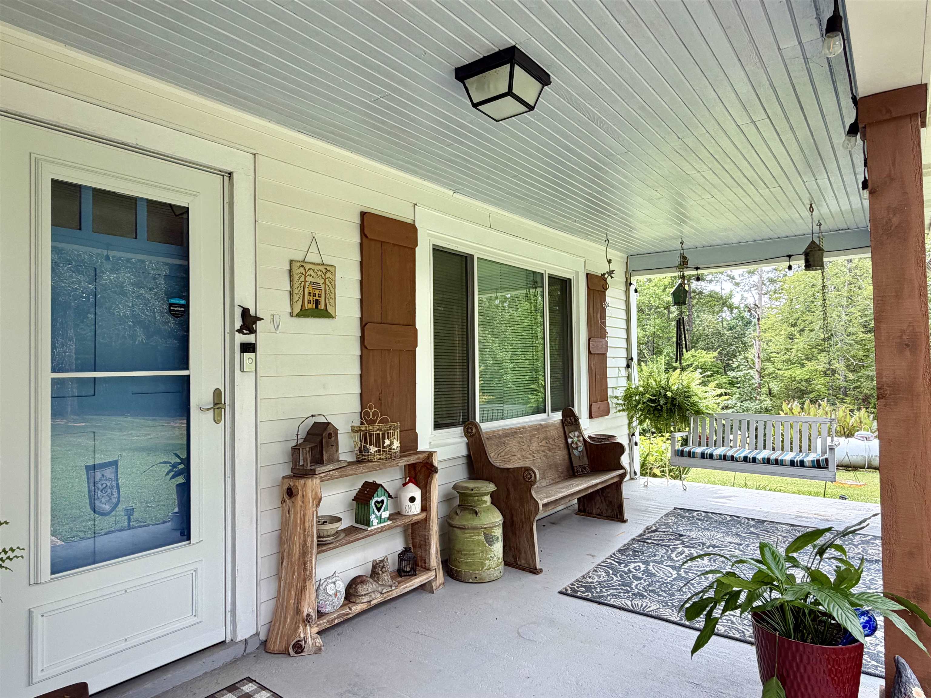 206 Burns Road Ramer, TN 38367 - Photo 2 of 37 Covered front porch featuring white siding and coordinating fixed window shutters