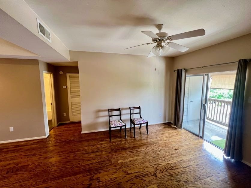 4041 Drake Street, Unit 118 Houston, TX 77005 - Photo 7 of 22 a view of a livingroom with furniture wooden floor ceiling fan and a window