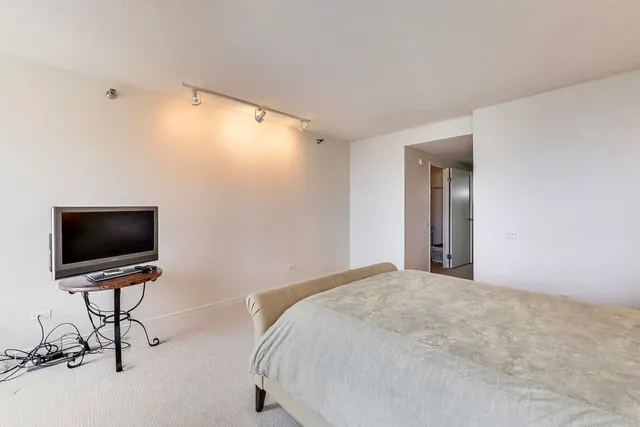 a view of a livingroom with a flat screen tv and a window