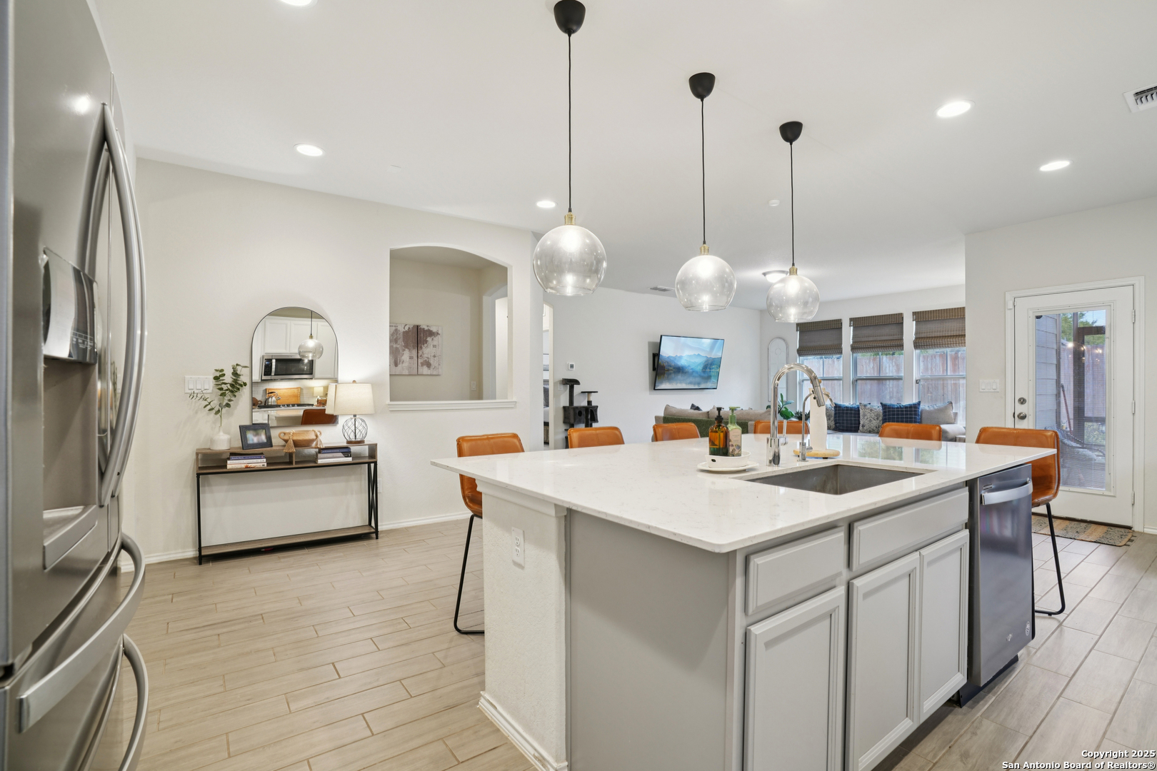 9028 Curling Post Schertz, TX 78154 - Photo 12 of 37 a view of kitchen island sink refrigerator and stove
