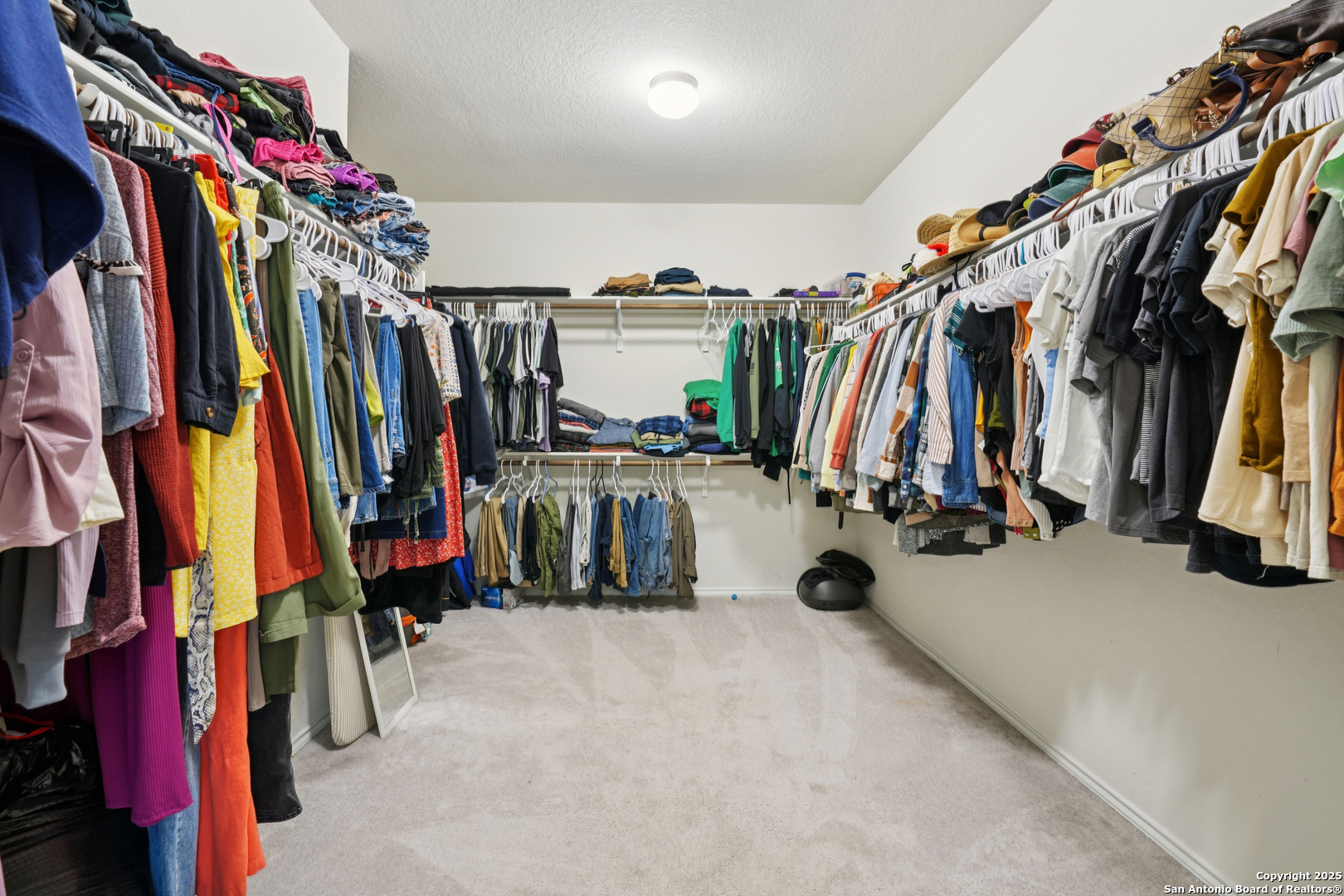 9028 Curling Post Schertz, TX 78154 - Photo 21 of 37 a view of walk in closet with clothes