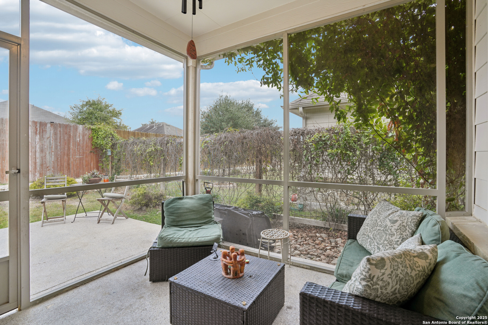 9028 Curling Post Schertz, TX 78154 - Photo 30 of 37 a living room with couch and a floor to ceiling window