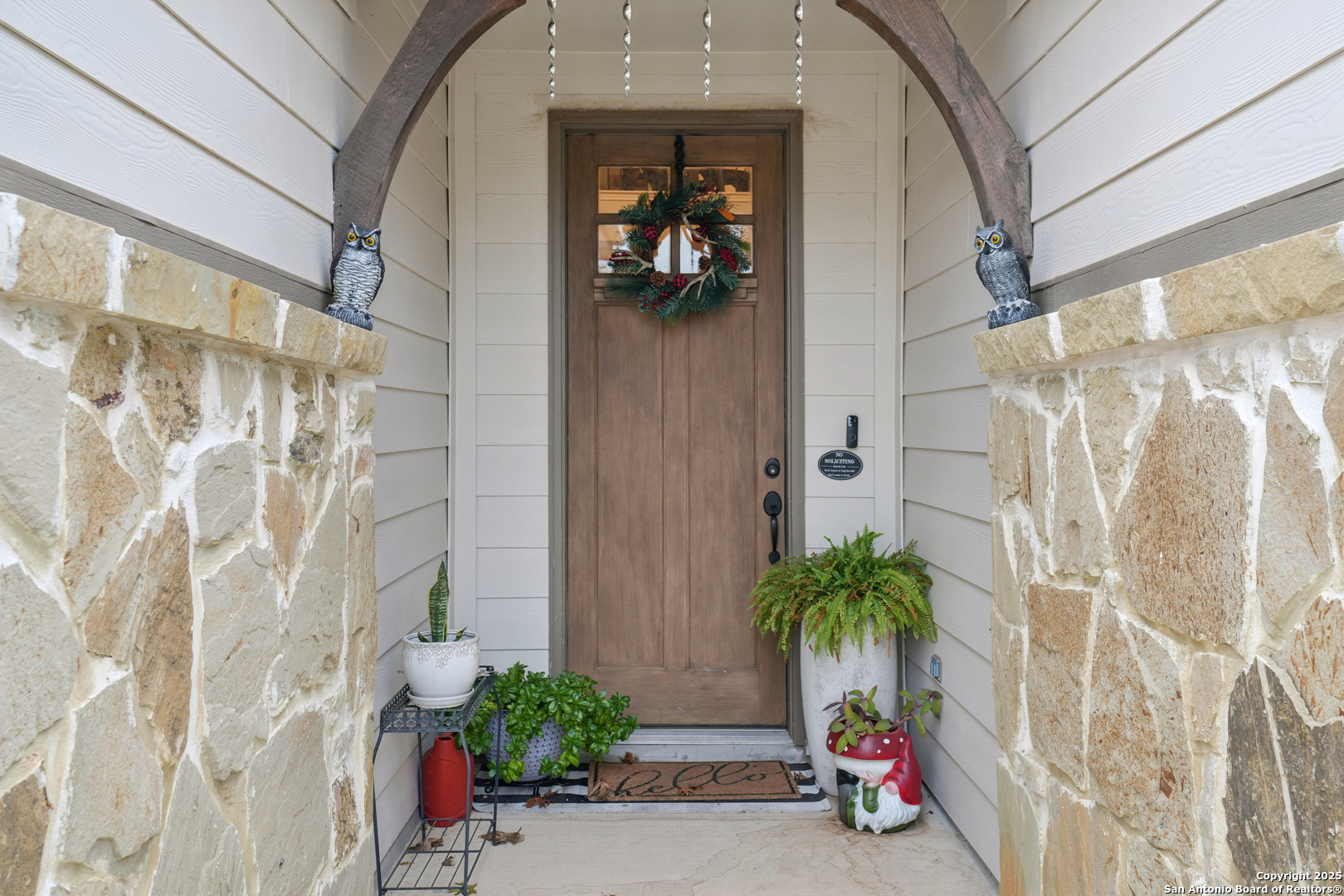 9028 Curling Post Schertz, TX 78154 - Photo 4 of 37 a potted plant sitting in front of a door