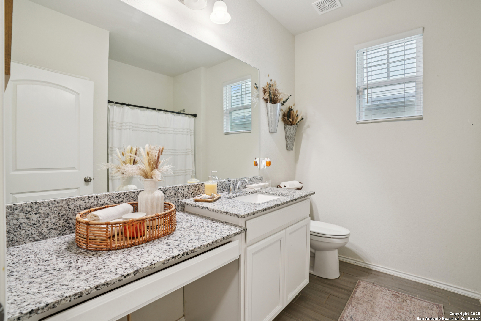 9028 Curling Post Schertz, TX 78154 - Photo 7 of 37 a bathroom with a granite countertop sink and a mirror