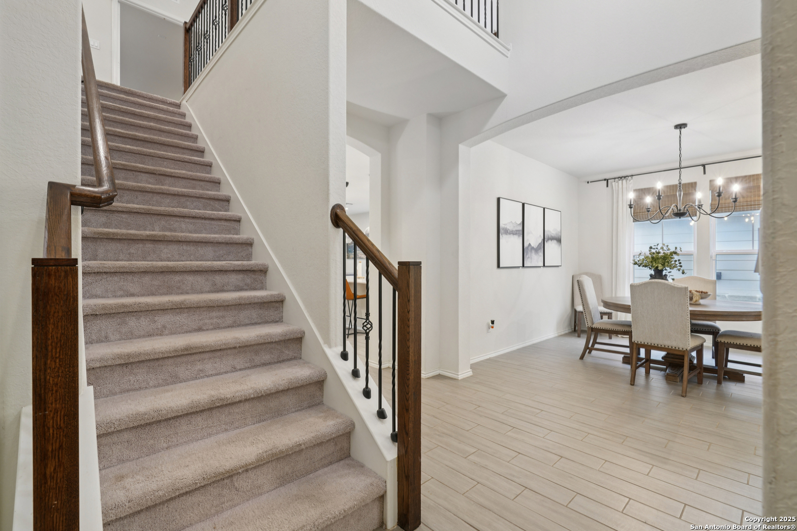 9028 Curling Post Schertz, TX 78154 - Photo 8 of 37 a view of a dining room with furniture entryway and wooden floor