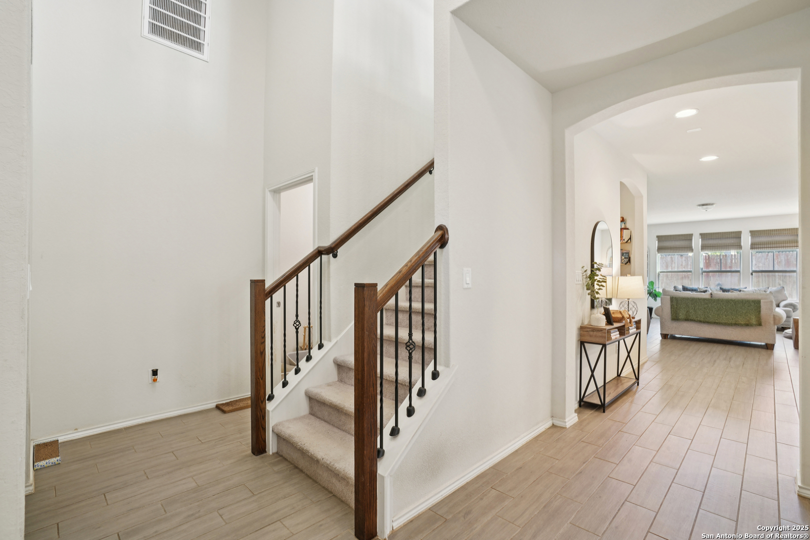 9028 Curling Post Schertz, TX 78154 - Photo 8 of 37 a view of an entryway with wooden floor and windows