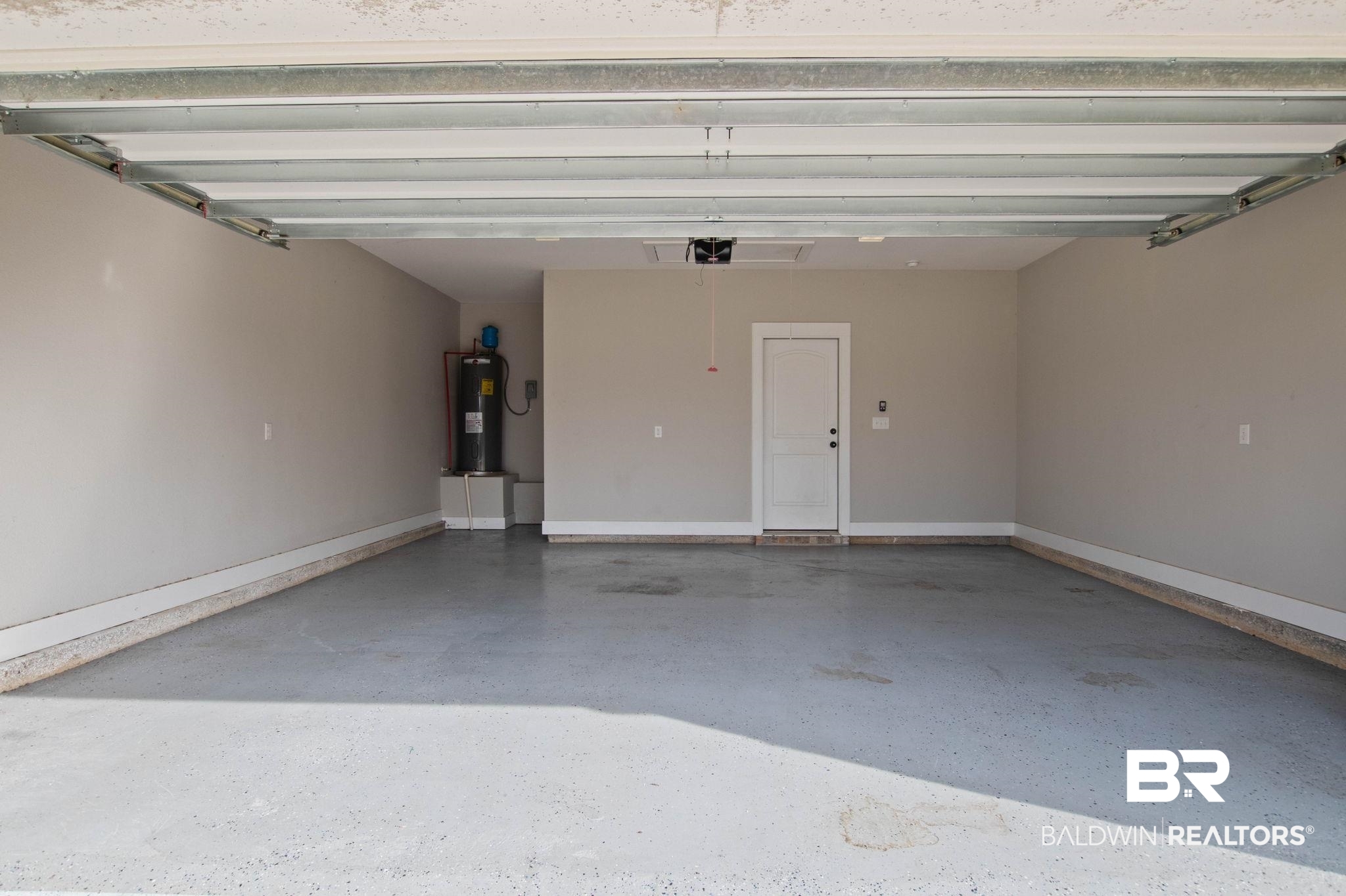 17376 Bankhead Boulevard Fairhope, AL 36532 - Photo 70 of 73 Garage featuring electric water heater and baseboards
