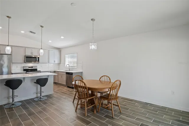 a view of a dining room with furniture