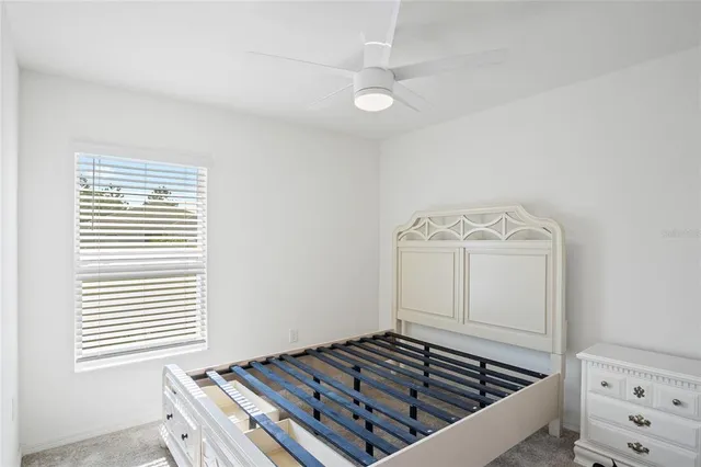 a view of a livingroom with wooden floor and white walls