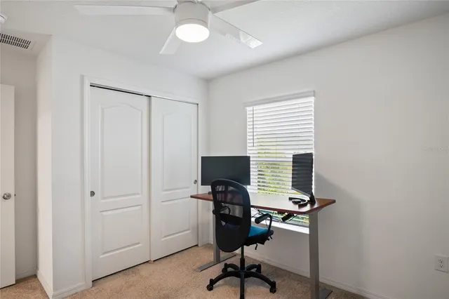 a view of a workspace with furniture