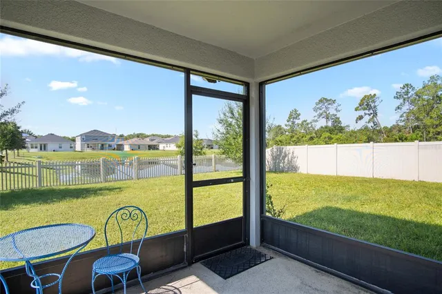 a view of a floor to ceiling window and an outdoor view