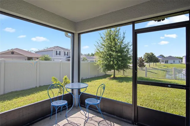 a blue bench sitting in front of a building