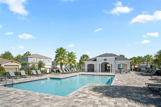 a large white house with a white roof and front view of a house