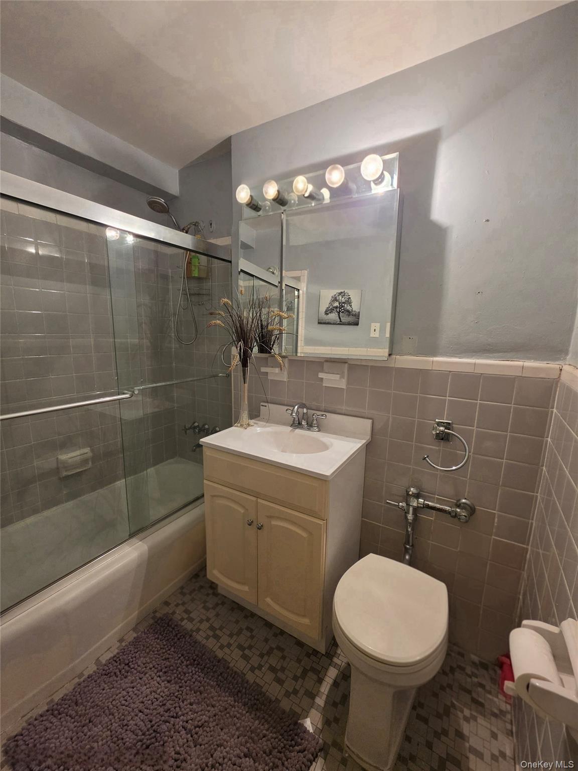 129 Beach 118th Street, Unit 5A Queens, NY 11694 - Photo 11 of 17 a bathroom with a sink toilet and shower