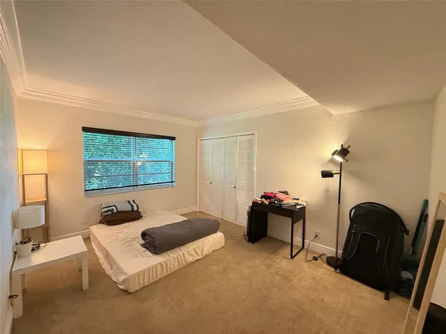 a bedroom with a bed and furniture