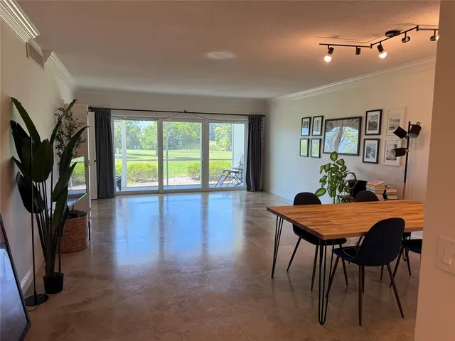a view of a livingroom with furniture window and wooden floor