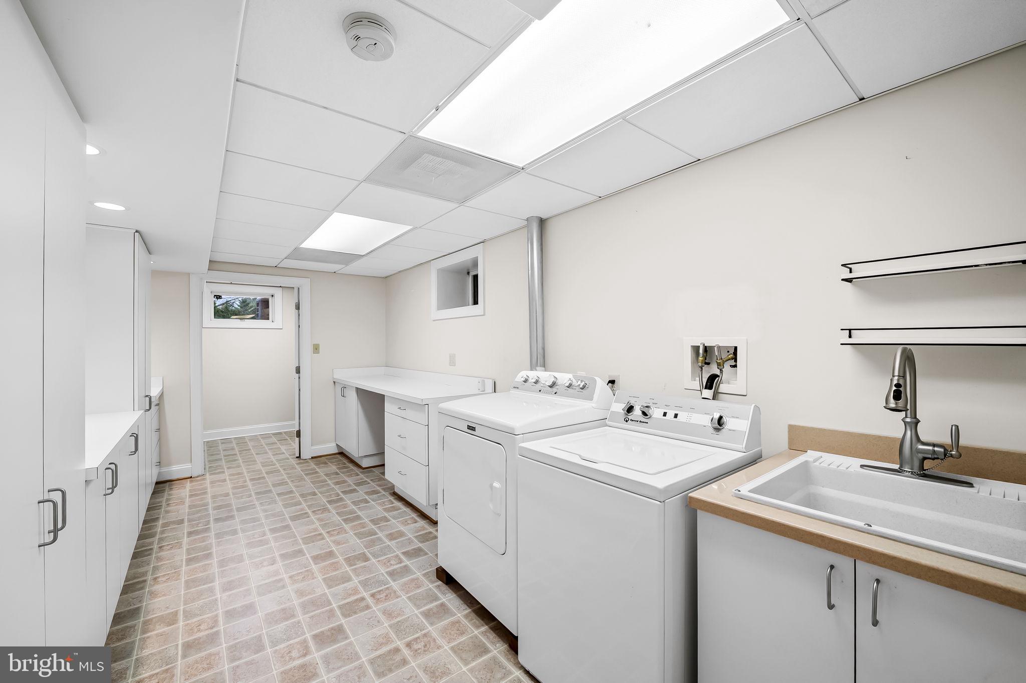 2202 Aquilas Delight Fallston, MD 21047 - Photo 21 of 35 a view of a kitchen with a sink and dishwasher a refrigerator with white cabinets