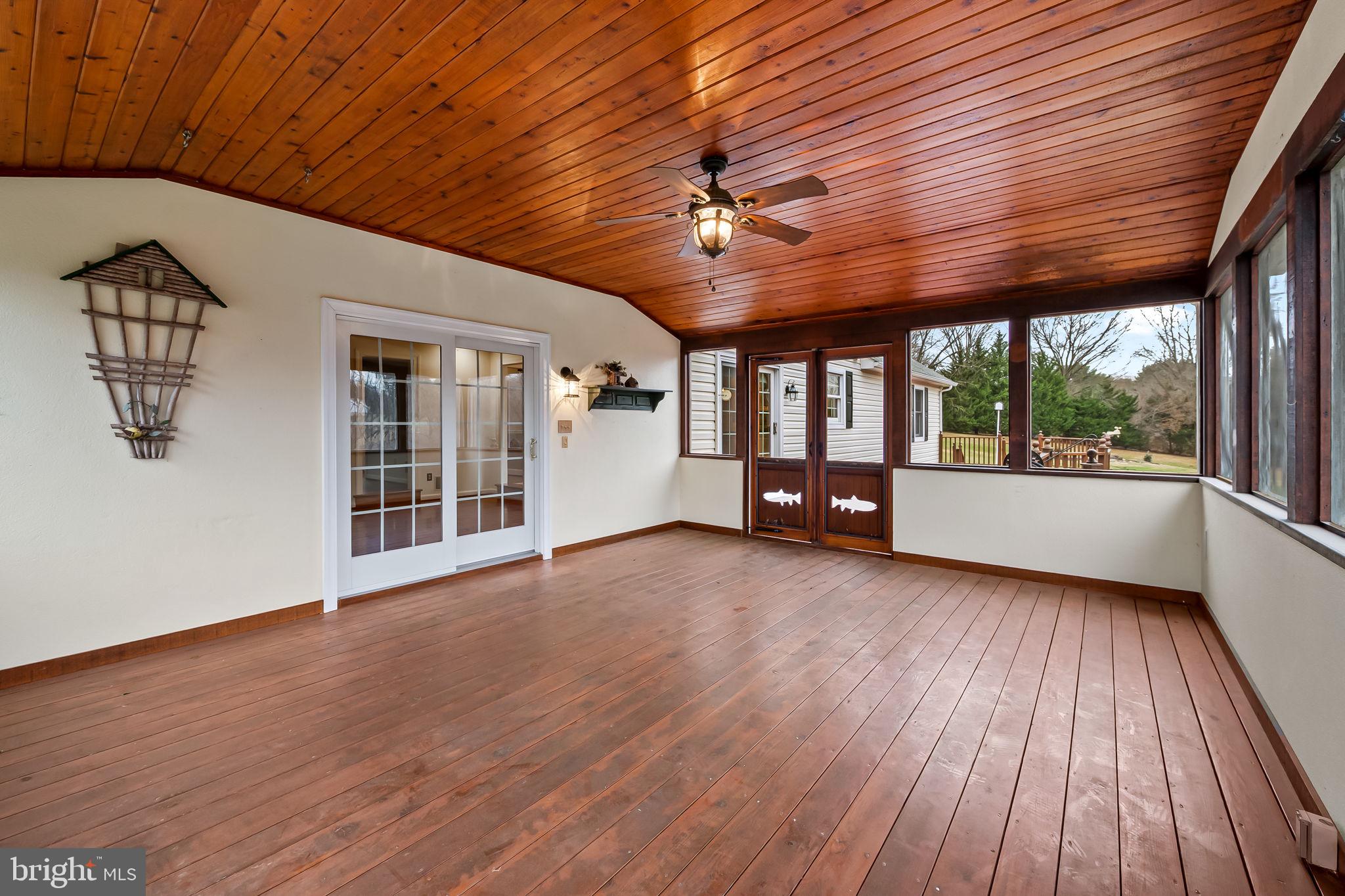 2202 Aquilas Delight Fallston, MD 21047 - Photo 23 of 35 a view of an empty room with wooden floor and a window
