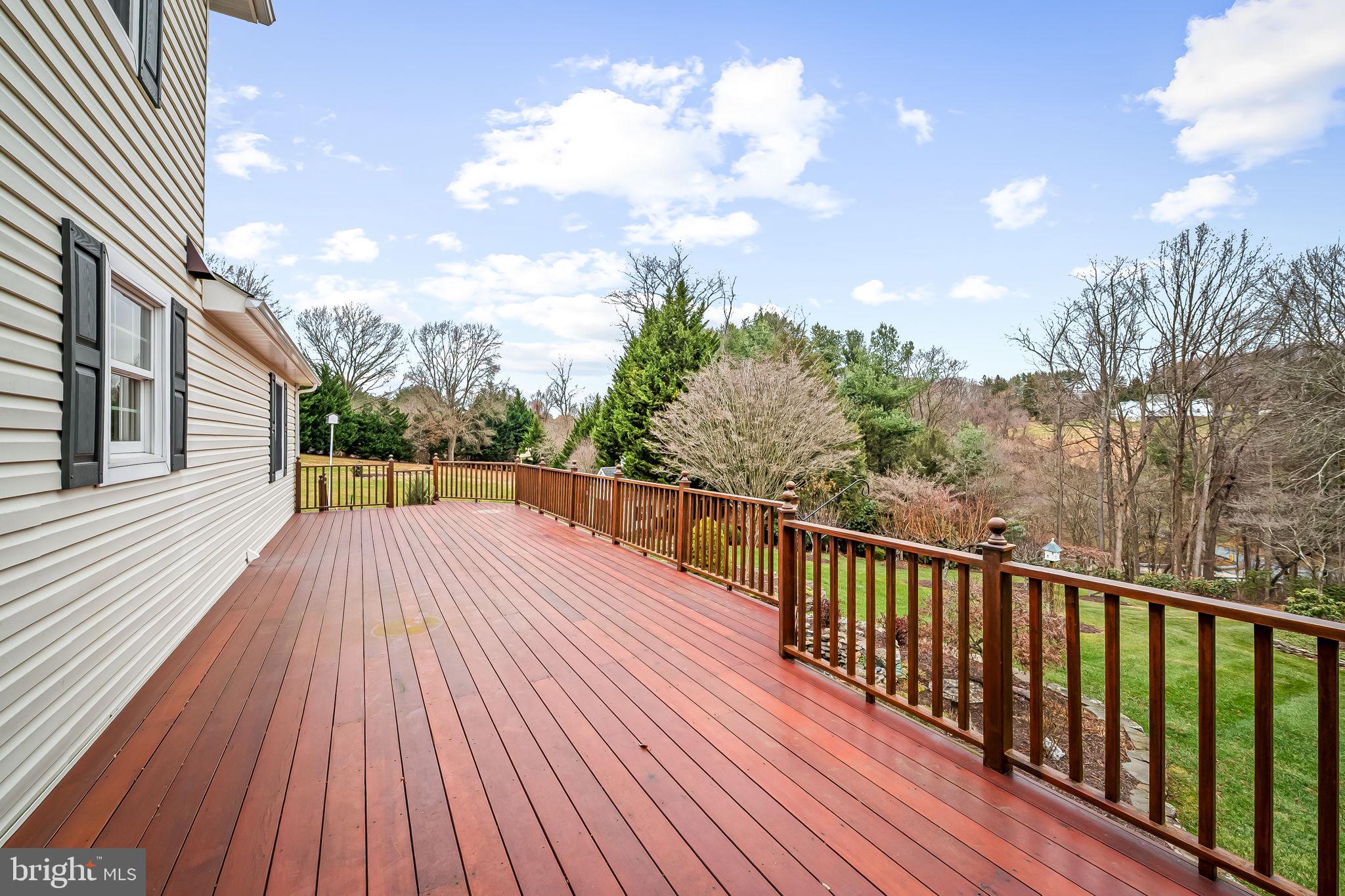 2202 Aquilas Delight Fallston, MD 21047 - Photo 24 of 35 a balcony with wooden floor and fence