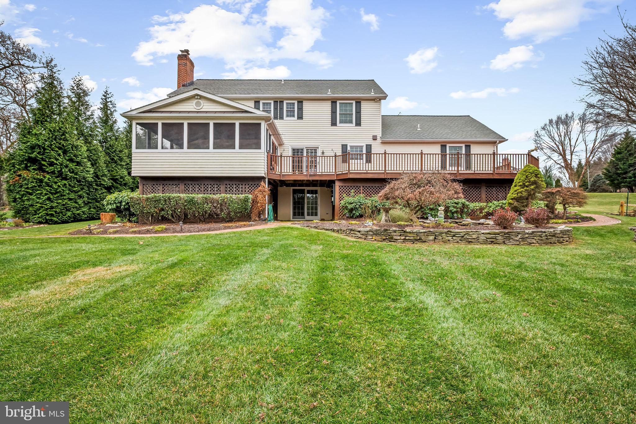 2202 Aquilas Delight Fallston, MD 21047 - Photo 27 of 35 a front view of a house with a garden and trees