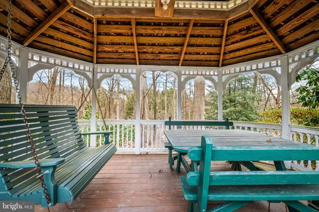 a view of a patio with a table and chairs