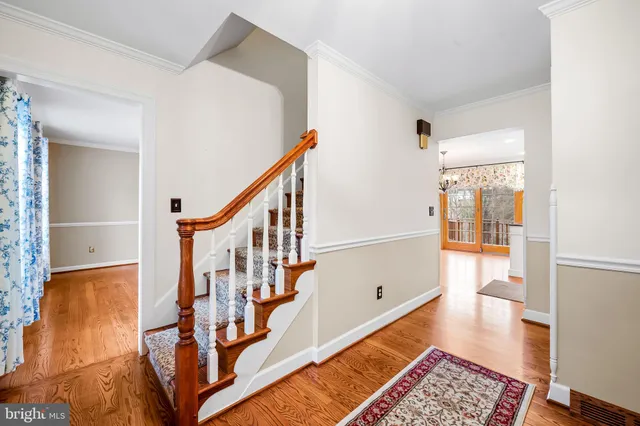 a view of an entryway with wooden floor