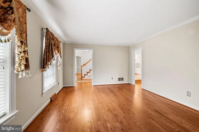 a view of an empty room with glass door