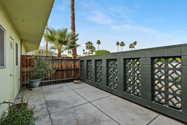 a view of a porch with wooden fence