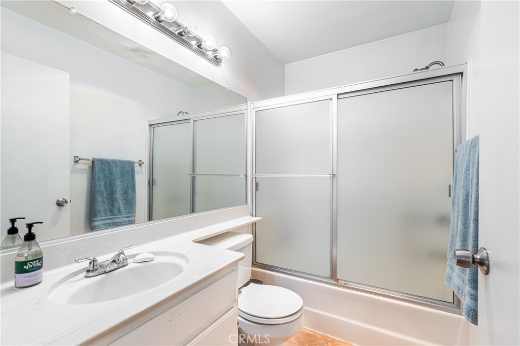 14610 Erwin Street, Unit 212 Van Nuys, CA 91411 - Photo 13 of 16 a bathroom with a sink toilet and shower